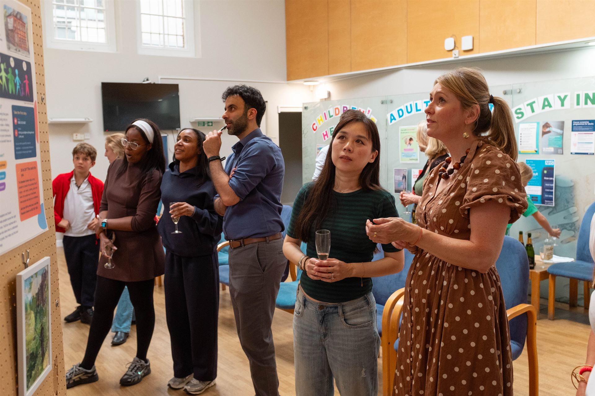 People looking at art work