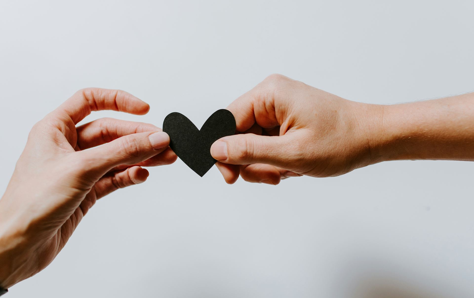 passing a paper heart from one person to another